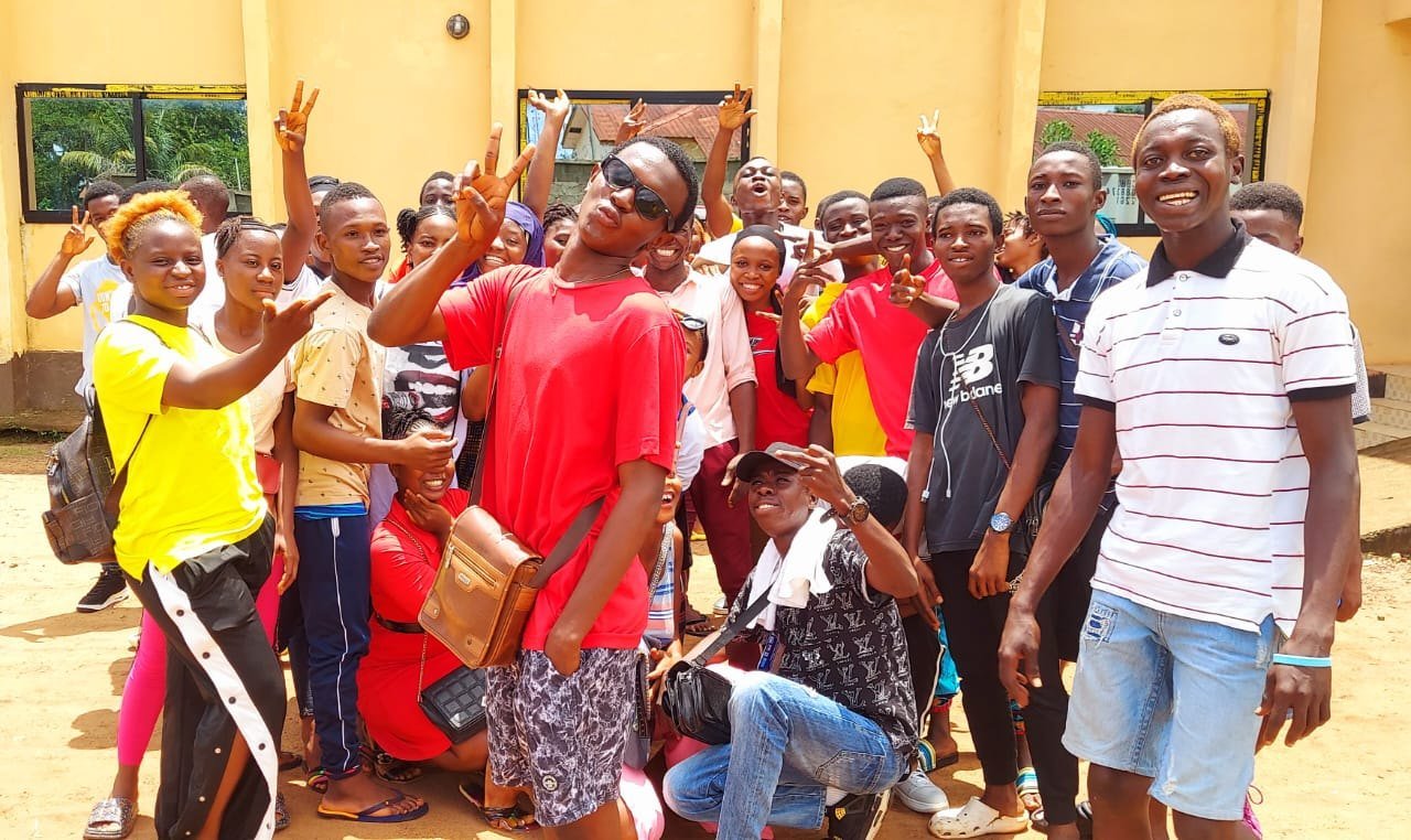 Students and project participants gathered outdoors