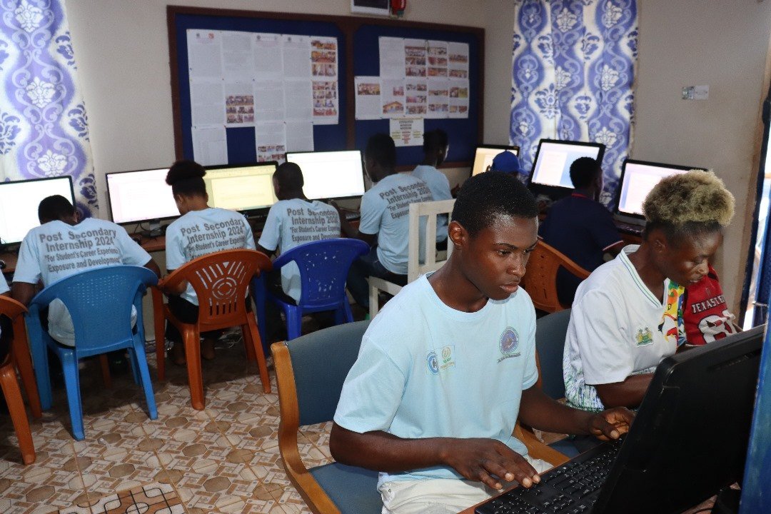 Students learning together in a computer classroom